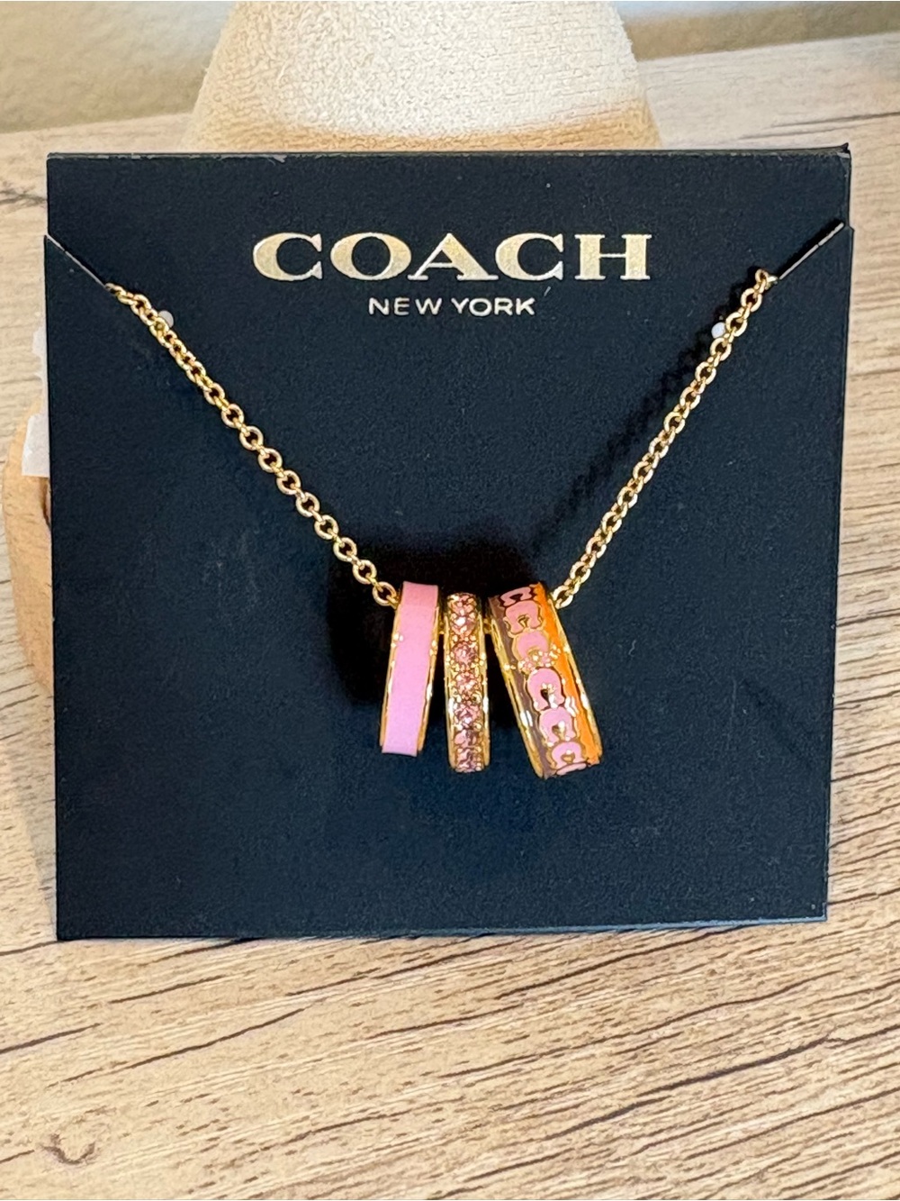 Coach Gold-Tone Rondel Necklace with Pink Enamel & Crystal Ring Charms